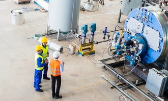 37847111 - industrial team of worker and engineer discussing at machine in factory